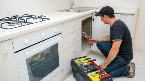 Sink being repaired by a person