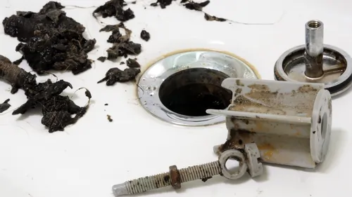 Sink with dirt and tools